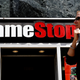 A customer walks outside a GameStop retail shop.